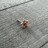20G 1/4 Red Gem Rose Gold Tone Textured Snowflake Nose Bone