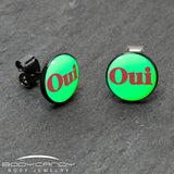 Black Anodized OUI Glow in the Dark Stud Earrings by Onyx O